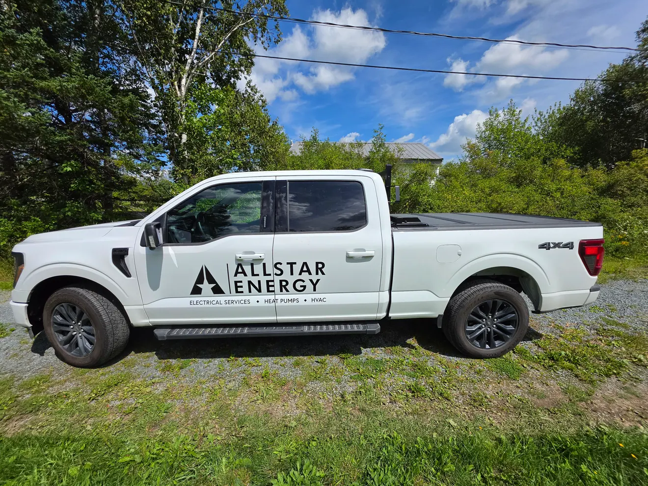 Allstar Energy cut-vinyl door lettering on a Ford pickup truck