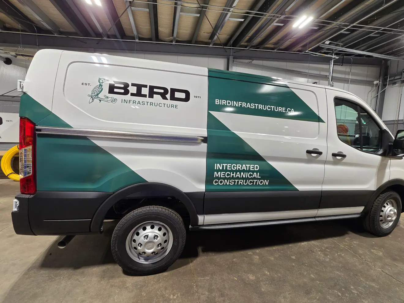 Bird Infrastructure mechanical construction van in green and white graphics