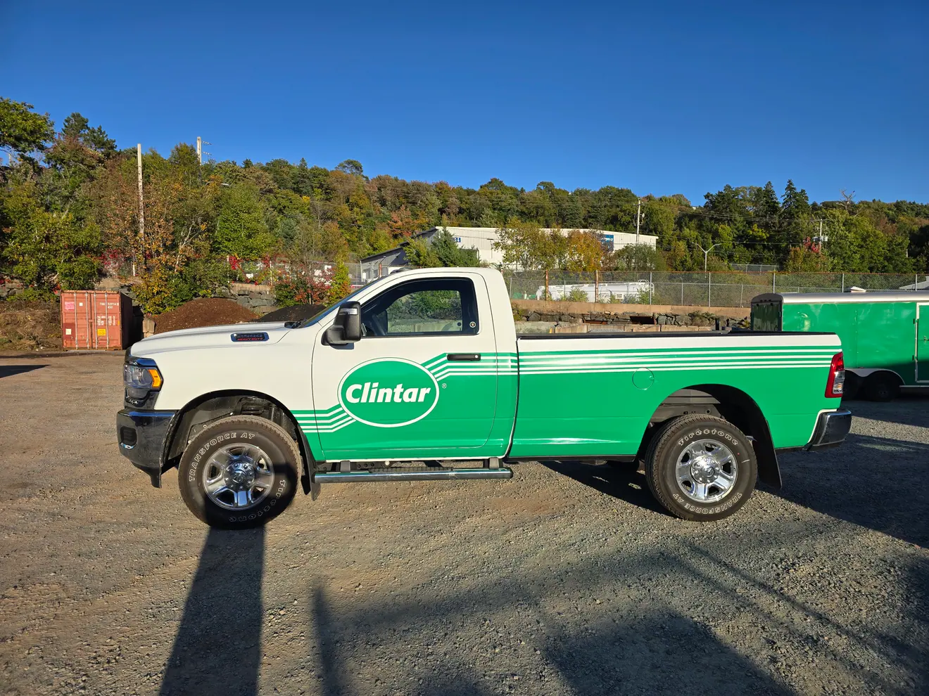 Clintar grounds management green wrap on a Ram work truck