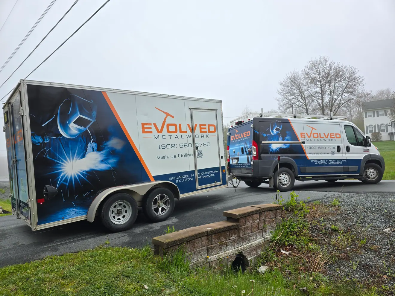 Evolved Metalworks enclosed trailer and matching van wrap