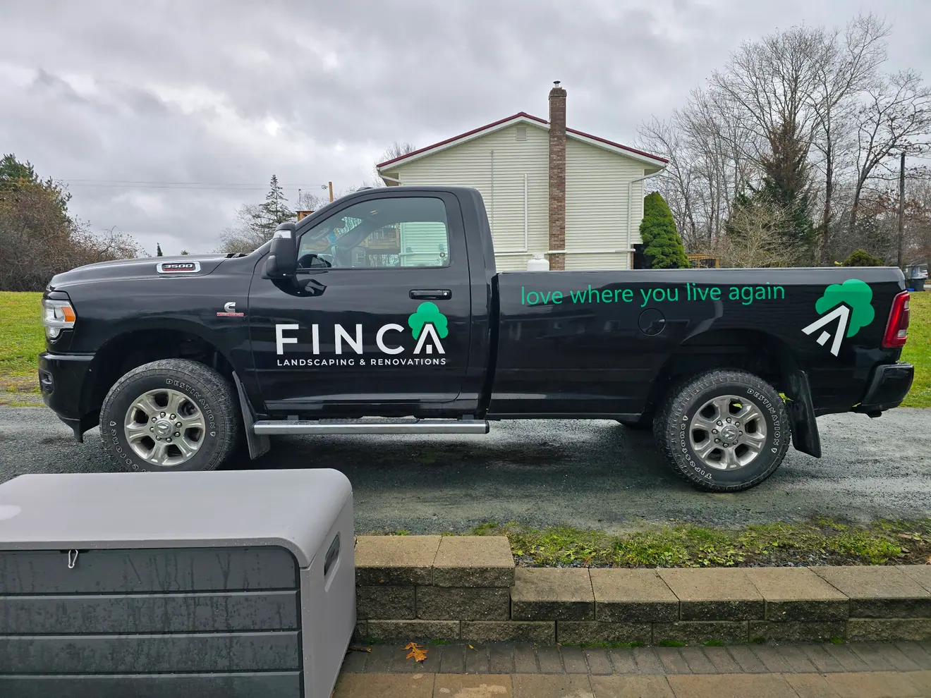 FINCA Landscaping & Renovations wrap on a black Ram pickup