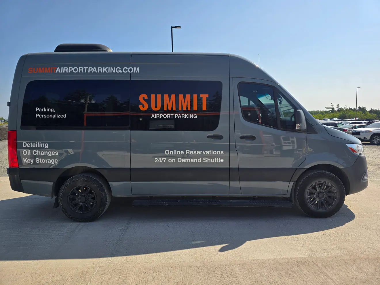 Summit Airport Parking shuttle wrap on a Mercedes-Benz Sprinter