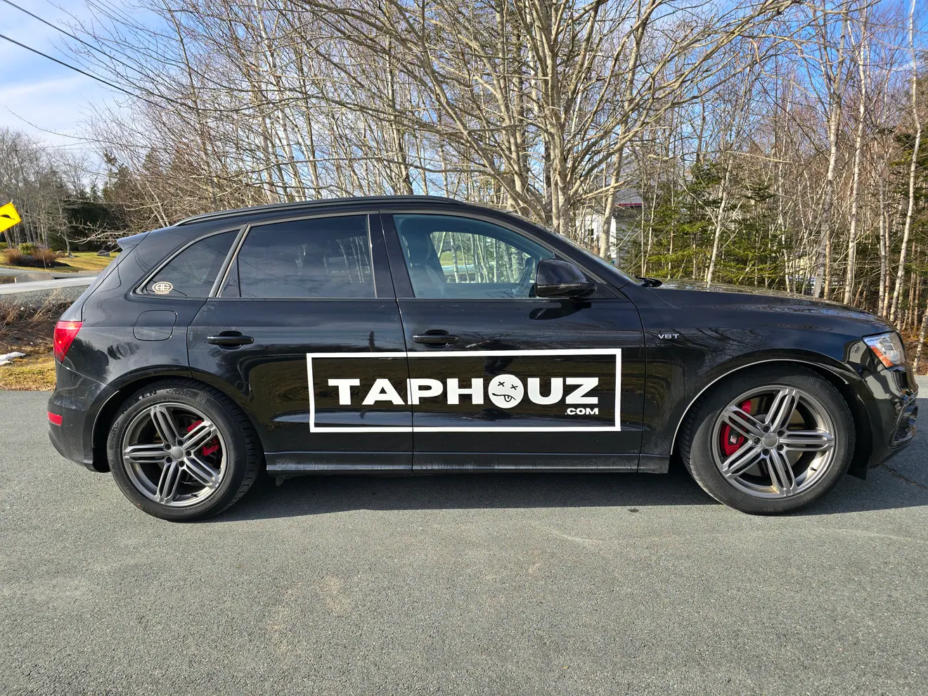 TAPHOUZ black gloss vehicle wrap with cut-vinyl lettering on an Audi SUV